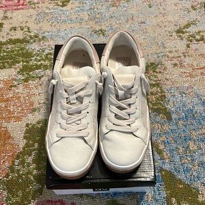 Leather tennis shoes.